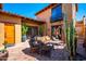 Inviting outdoor patio featuring comfortable seating, lush plants, and a cozy ambiance at 10597 E Rising Sun Dr, Scottsdale, AZ 85262