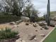 Desert garden showcasing rocks, cacti, and drought-tolerant plants at 11415 E Four Peaks Rd, Scottsdale, AZ 85262