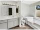 Bright bathroom with a double vanity, and a separate tub and shower at 11609 N 30Th Ln, Phoenix, AZ 85029