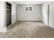 Spacious bedroom with a large closet and a window providing natural light at 11609 N 30Th Ln, Phoenix, AZ 85029