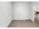 Neutral bedroom with textured walls, light carpet, and access to additional rooms in the home at 11609 N 30Th Ln, Phoenix, AZ 85029