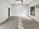Bright bedroom featuring a ceiling fan and large window providing natural light at 11609 N 30Th Ln, Phoenix, AZ 85029