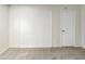Bedroom with textured walls, light carpet and a white door leading to other rooms in the house at 11609 N 30Th Ln, Phoenix, AZ 85029