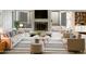 Bright living room featuring a fireplace, large windows, and neutral-toned furniture at 11609 N 30Th Ln, Phoenix, AZ 85029