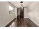 Dining Room featuring hardwood floors, modern light fixture and large windows at 13621 N 16Th Ave, Phoenix, AZ 85023