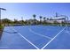 Community blue basketball court with well maintained landscape and clubhouse at 14598 W Wood Dr, Surprise, AZ 85379