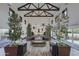 Clubhouse entryway features modern design, lush greenery, and casual seating at 14598 W Wood Dr, Surprise, AZ 85379
