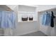 Organized walk-in closet with ample shelving and hanging space for clothes and accessories at 14598 W Wood Dr, Surprise, AZ 85379