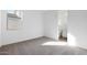 Bright bedroom with neutral carpet and a view of the backyard at 14787 W El Cortez Pl, Surprise, AZ 85387