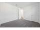 Bright bedroom featuring plush gray carpeting and neutral walls at 14787 W El Cortez Pl, Surprise, AZ 85387