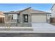 Charming single-story home with neutral tones, desert landscaping, and a convenient two-car garage at 14787 W El Cortez Pl, Surprise, AZ 85387