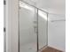Modern shower with glass doors and chrome hardware at 14787 W El Cortez Pl, Surprise, AZ 85387