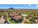 Overhead view showcasing a community clubhouse, pool, parking, and surrounding residential neighborhood at 1644 N Lynch --, Mesa, AZ 85207