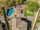 Aerial view of the private backyard featuring a pool, pergola, putting green, and lounge area at 1644 N Lynch --, Mesa, AZ 85207