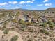 Expansive community aerial view with mountain backdrops and wide streets lined with beautiful homes at 1644 N Lynch --, Mesa, AZ 85207
