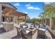 Relaxing backyard with a pool, seating area, fire pit and outdoor kitchen, perfect for entertaining guests at 1644 N Lynch --, Mesa, AZ 85207
