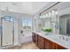 Bright bathroom featuring a double vanity, jetted tub, and a separate shower with natural light streaming in at 1644 N Lynch --, Mesa, AZ 85207