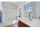 Clean and bright bathroom featuring a shower-tub combo, sleek vanity, and well-lit mirror at 1644 N Lynch --, Mesa, AZ 85207