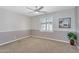 Inviting bedroom with a ceiling fan, plush carpeting, and plenty of natural light at 1644 N Lynch --, Mesa, AZ 85207