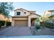 Charming two-story home with desert landscaping and a brick paved driveway at 1644 N Lynch --, Mesa, AZ 85207