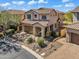 A beautiful two-story home with a tile roof, desert landscaping, and an attached two-car garage in a quiet residential neighborhood at 1644 N Lynch --, Mesa, AZ 85207