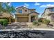 Charming front exterior with a well-manicured landscape, brick driveway, and a two-car garage at 1644 N Lynch --, Mesa, AZ 85207