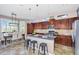 Open-concept kitchen with granite countertops, stainless steel appliances, and island seating at 1644 N Lynch --, Mesa, AZ 85207