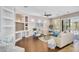 Bright living room featuring light walls, hardwood floors, large windows and sliding glass door at 1644 N Lynch --, Mesa, AZ 85207