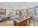 Open-concept living space features living room, dining area, and kitchen with stainless steel appliances at 1644 N Lynch --, Mesa, AZ 85207