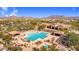 Aerial view of a community pool and hot tub, including seating and desert landscape at 1644 N Lynch --, Mesa, AZ 85207