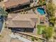 Aerial view of the backyard with a pool, pergola, putting green and an outdoor living area at 1644 N Lynch --, Mesa, AZ 85207