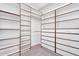 A large walk-in closet with custom shelving and drawer units to keep your wardrobe organized at 1644 N Lynch --, Mesa, AZ 85207