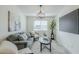 Comfortable living room featuring contemporary furniture, elegant lighting, and decorative plant accents at 1712 W 11Th Ave, Apache Junction, AZ 85120