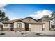 Charming single-story home with desert landscaping, neutral paint, and a 3-car garage at 18364 W Navajo St, Goodyear, AZ 85338
