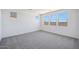 An empty bedroom featuring carpeted floors, recessed lighting and bright, white walls at 18447 W Mohave St, Goodyear, AZ 85338