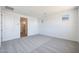 An empty bedroom featuring carpeted floors, recessed lighting and bright, white walls at 18447 W Mohave St, Goodyear, AZ 85338