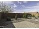 Desert landscaping with plants, privacy wall and a brick-paved patio at 1973 N Lewis Pl, Casa Grande, AZ 85122