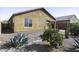 Low maintenance backyard featuring desert landscaping and a covered patio at 1973 N Lewis Pl, Casa Grande, AZ 85122