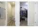 Bathroom featuring a toilet and closet with organized storage, and tile floors at 1973 N Lewis Pl, Casa Grande, AZ 85122