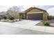 Inviting single-story home featuring a well-maintained yard with desert landscaping and a spacious two-car garage at 1973 N Lewis Pl, Casa Grande, AZ 85122