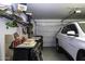 Attached garage with tools, car and storage racks at 1973 N Lewis Pl, Casa Grande, AZ 85122