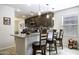 Kitchen featuring a granite island with bar stool seating and pendant lighting above at 1973 N Lewis Pl, Casa Grande, AZ 85122