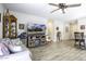 Spacious living room featuring a large television, comfortable seating, and bright natural light at 1973 N Lewis Pl, Casa Grande, AZ 85122