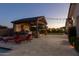 Inviting backyard showcasing a covered outdoor kitchen, perfect for entertaining at 19777 E Ivy Ln, Queen Creek, AZ 85142