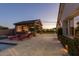 Inviting backyard showcasing a covered outdoor kitchen, perfect for entertaining at 19777 E Ivy Ln, Queen Creek, AZ 85142