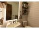 Charming powder room with modern fixtures, shiplap walls, and decorative shelving at 19777 E Ivy Ln, Queen Creek, AZ 85142
