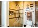 Elegant bathroom featuring a glass door shower, tiled walls, and a modern toilet at 19777 E Ivy Ln, Queen Creek, AZ 85142