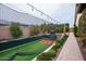 A view of the professional quality batting cage and pitching mound in the landscaped backyard at 19777 E Ivy Ln, Queen Creek, AZ 85142