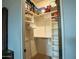 A closet with shelving and hanging racks for optimal storage and organization at 19777 E Ivy Ln, Queen Creek, AZ 85142
