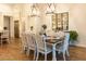 Open-concept dining area with farmhouse style table, chairs, and decor at 19777 E Ivy Ln, Queen Creek, AZ 85142